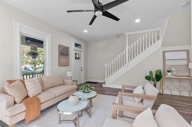 living room featuring hardwood / wood-style flooring and ceiling fan