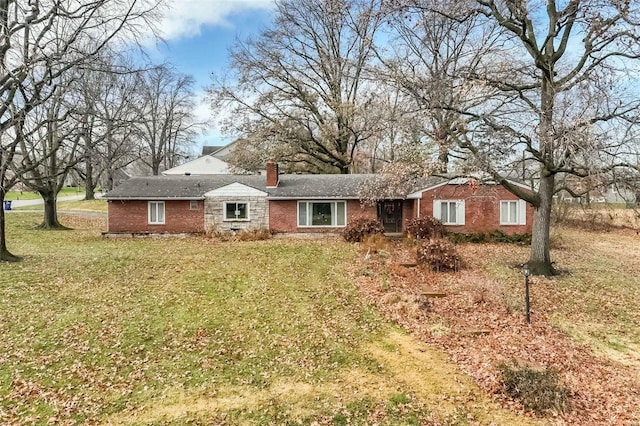 ranch-style house with a front lawn