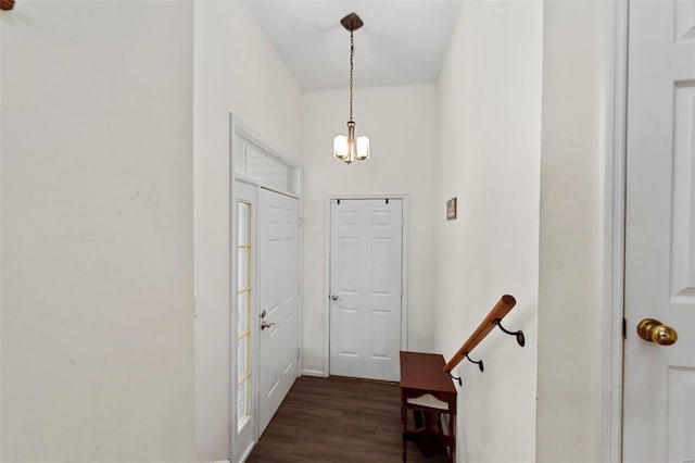 interior space featuring a notable chandelier and dark hardwood / wood-style flooring