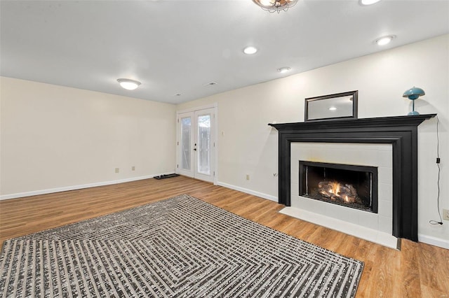 unfurnished living room with hardwood / wood-style flooring