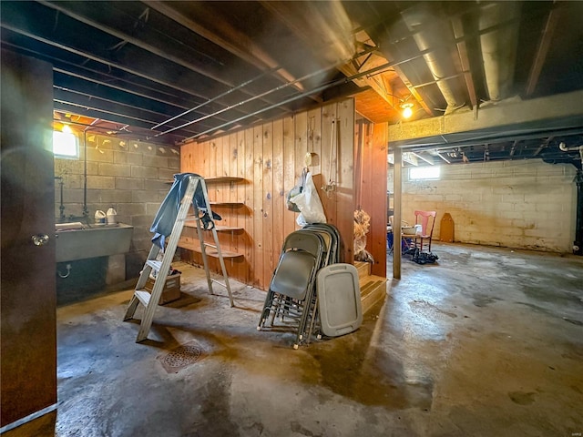 basement with sink and a healthy amount of sunlight