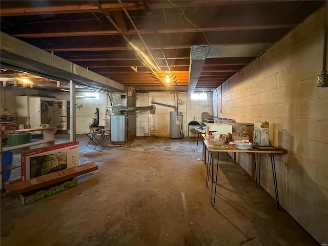 basement with heating unit and water heater