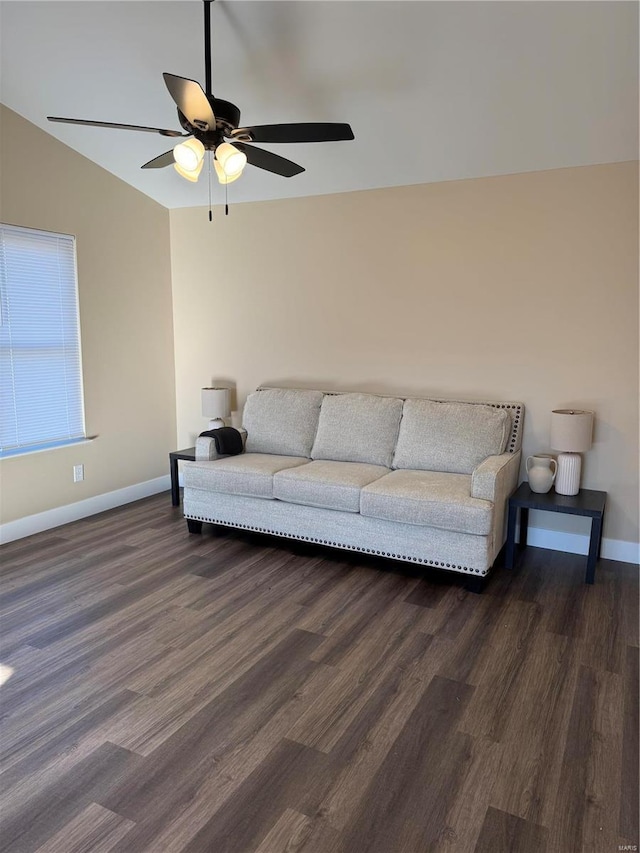 living room featuring lofted ceiling, dark hardwood / wood-style floors, and ceiling fan