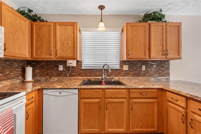 kitchen featuring tasteful backsplash, sink, a textured ceiling, and white appliances