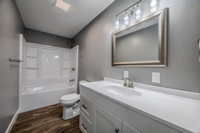 full bathroom featuring shower / washtub combination, hardwood / wood-style floors, vanity, and toilet