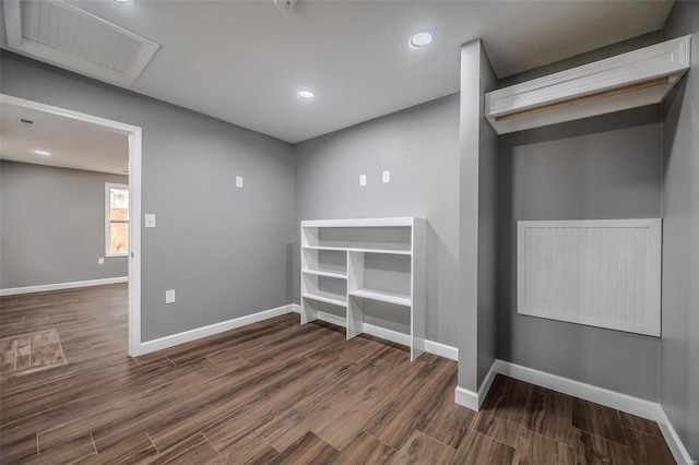 unfurnished room featuring dark wood-type flooring