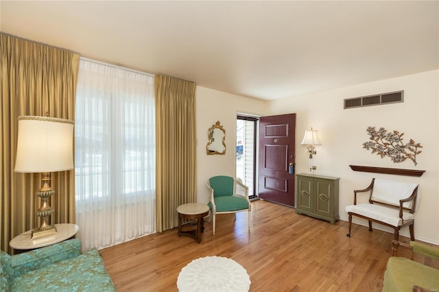 living area with light hardwood / wood-style floors