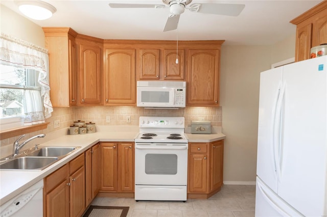 kitchen with sink, white appliances, light tile patterned floors, ceiling fan, and decorative backsplash