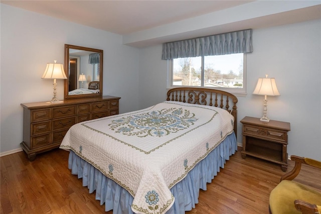 bedroom with hardwood / wood-style floors