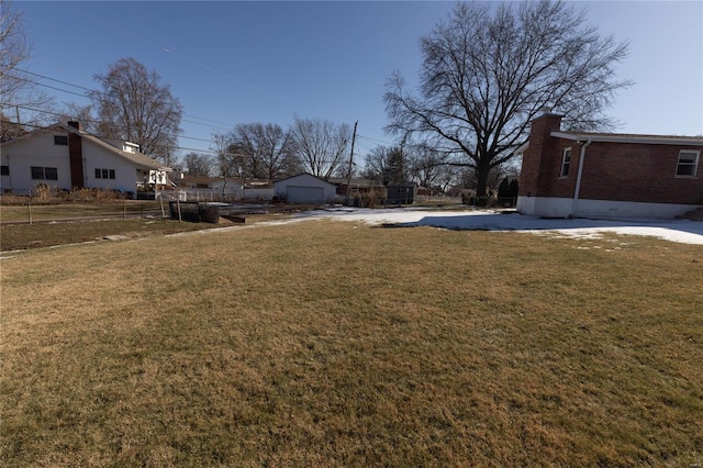 view of yard with a garage