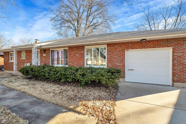 ranch-style home featuring a garage