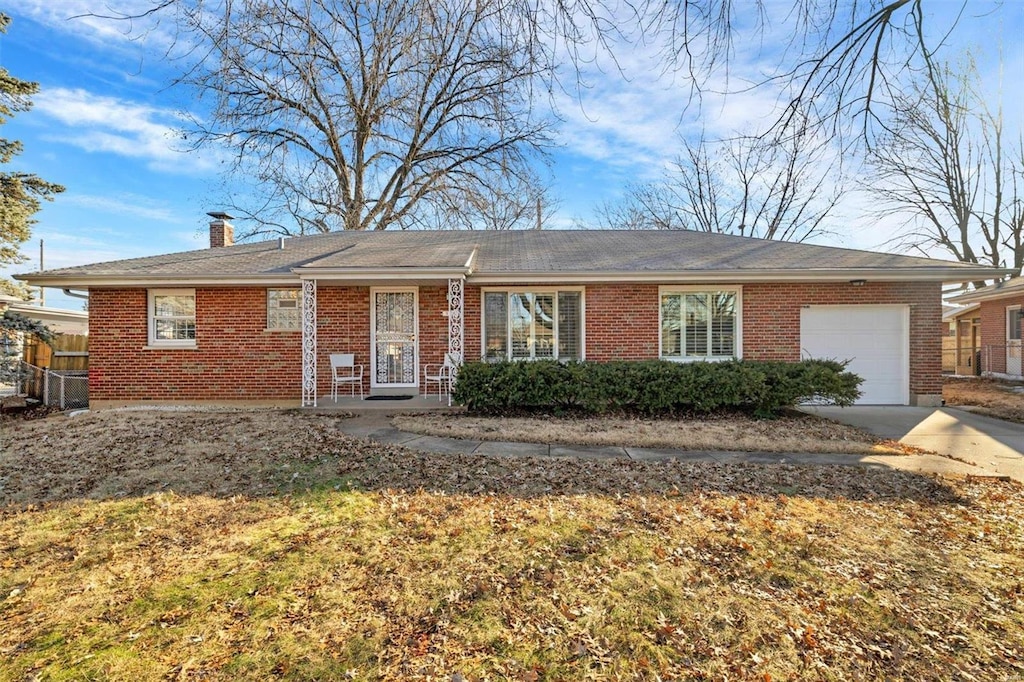 single story home featuring a garage