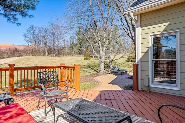 wooden deck with a yard