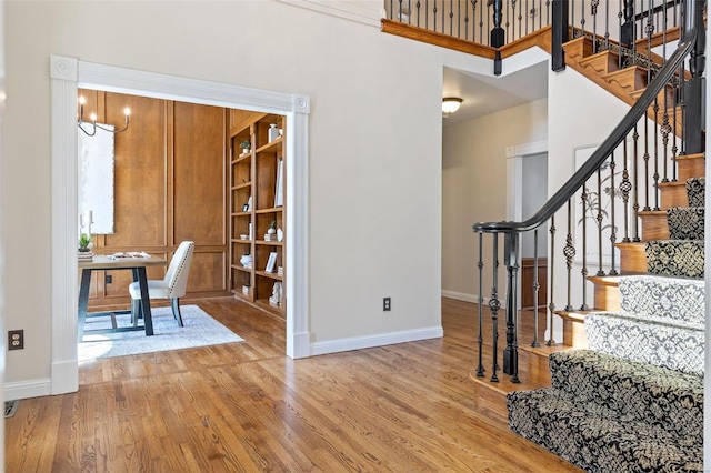 interior space with wood finished floors and baseboards