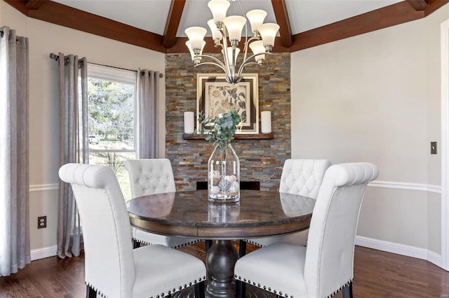 dining area featuring dark wood-style floors, a notable chandelier, baseboards, and beam ceiling