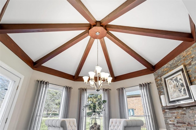 interior space featuring a chandelier and beam ceiling