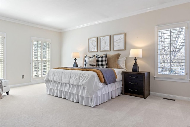 bedroom with crown molding, baseboards, visible vents, and light colored carpet