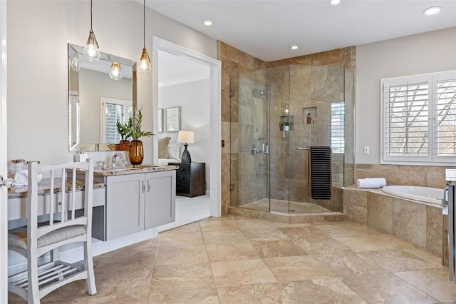 bathroom with a garden tub, a shower stall, vanity, and recessed lighting