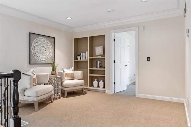 sitting room featuring carpet, crown molding, baseboards, and recessed lighting