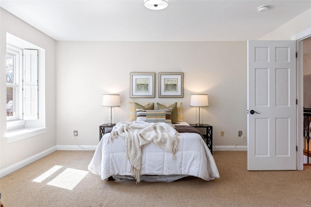 bedroom featuring carpet flooring and baseboards