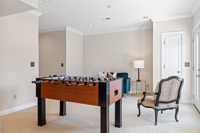 recreation room featuring visible vents, ornamental molding, baseboards, and light colored carpet