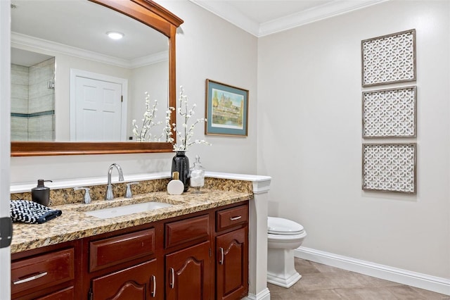 bathroom with baseboards, toilet, vanity, and crown molding