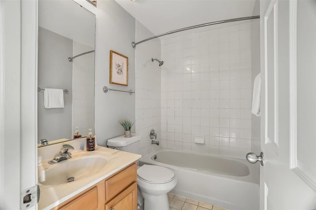 bathroom featuring tile patterned flooring, shower / bath combination, vanity, and toilet