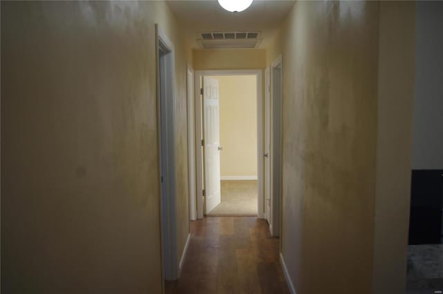 hallway with hardwood / wood-style floors