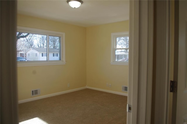 unfurnished room featuring carpet flooring