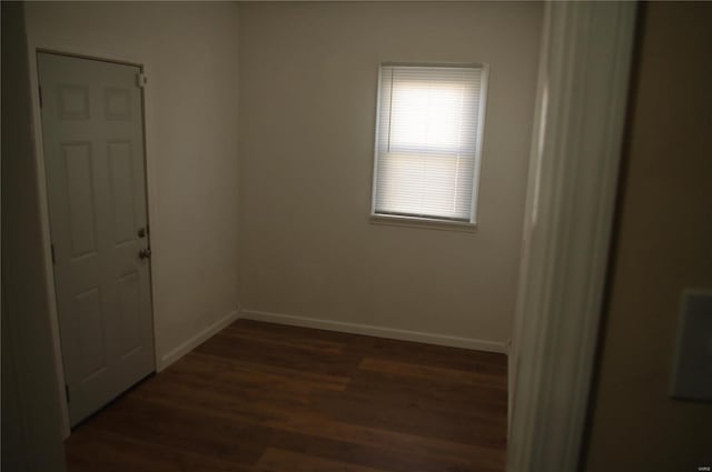 spare room featuring dark hardwood / wood-style flooring