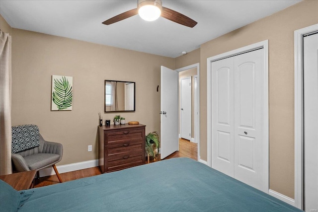 bedroom with ceiling fan, a closet, and light wood-type flooring