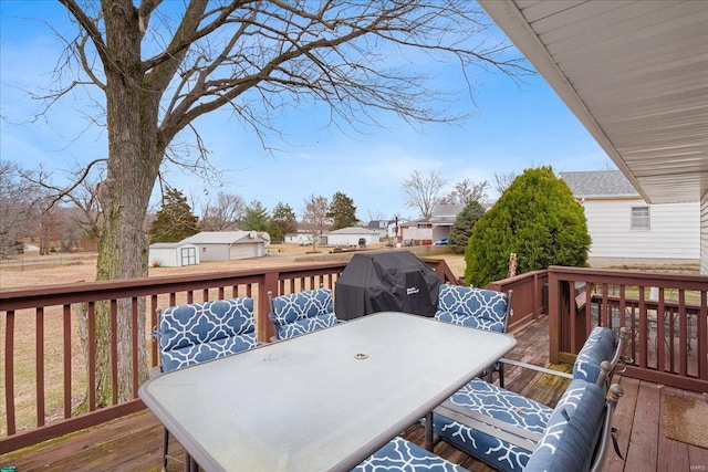 wooden terrace featuring area for grilling