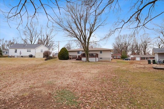 view of yard with a wooden deck