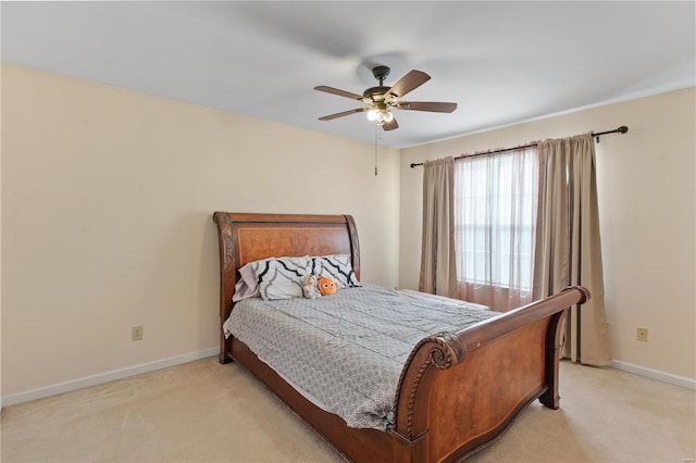 bedroom with light carpet and ceiling fan