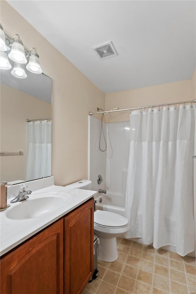 bathroom with shower / bath combo, visible vents, vanity, and toilet