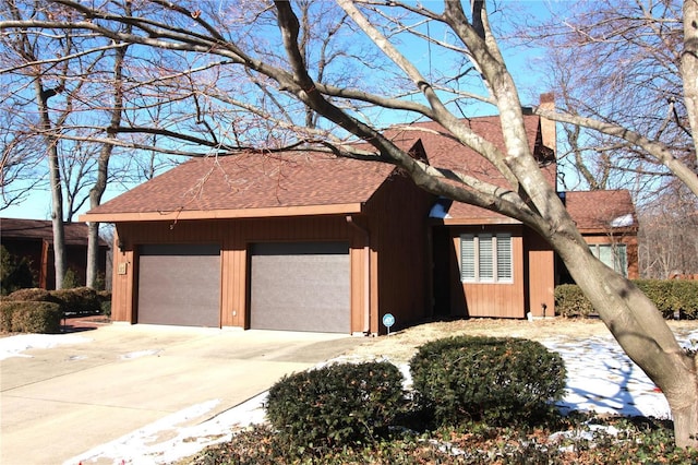 view of front of house with a garage and an outdoor structure