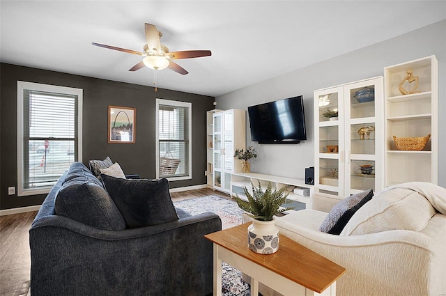 living room with hardwood / wood-style flooring and ceiling fan