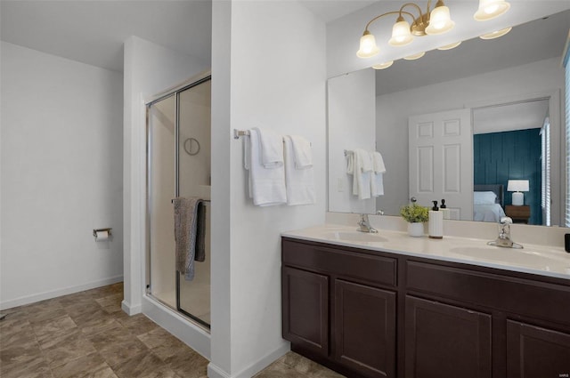 bathroom with vanity and a shower with shower door