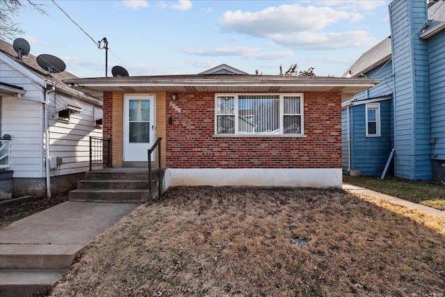 view of front facade featuring brick siding