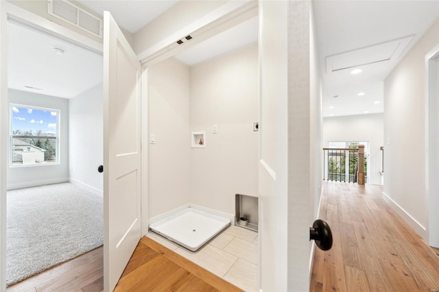 hall featuring visible vents, baseboards, recessed lighting, and light wood-style floors