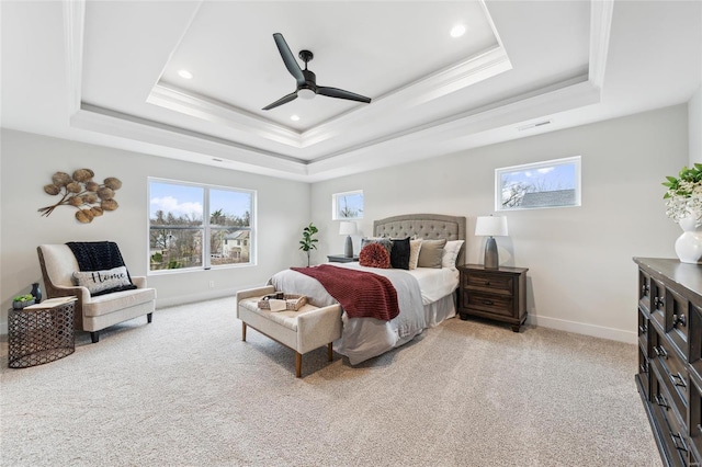 carpeted bedroom featuring baseboards, recessed lighting, visible vents, a tray ceiling, and ceiling fan