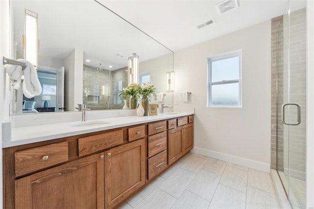 full bathroom with a shower stall, visible vents, and a sink