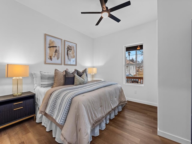 bedroom with dark wood-type flooring and ceiling fan