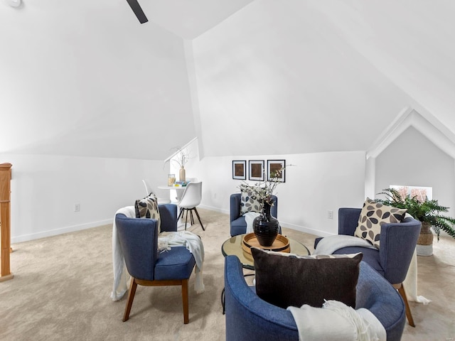 sitting room featuring lofted ceiling and light colored carpet