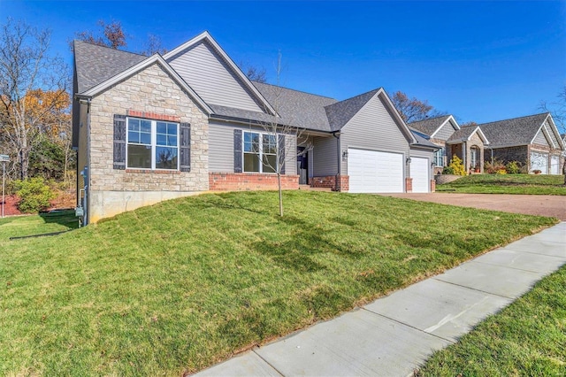 view of front of property with a garage and a front yard