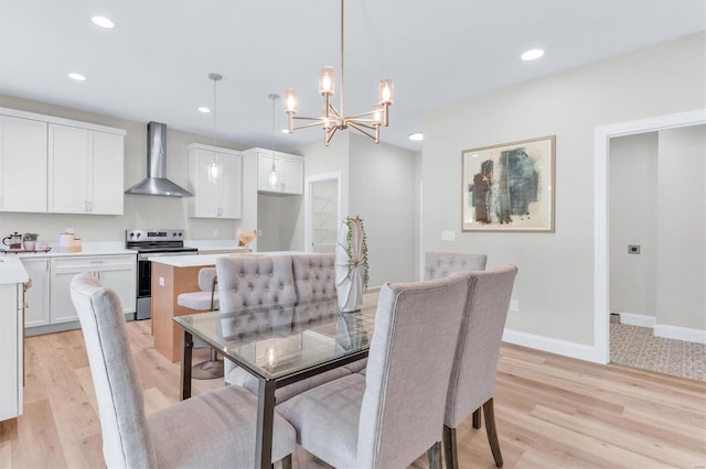 dining room featuring an inviting chandelier and light hardwood / wood-style floors