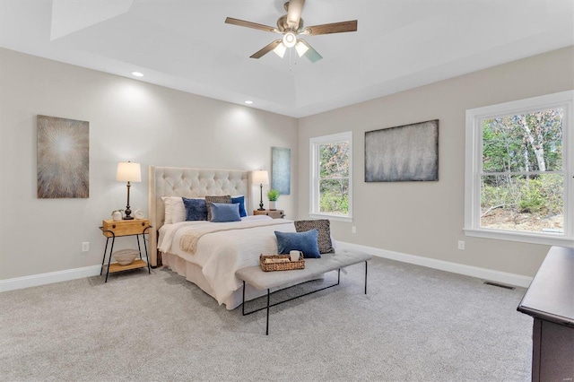 bedroom featuring light colored carpet and ceiling fan