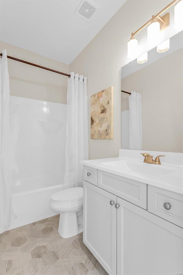 full bathroom with shower / bath combination with curtain, vanity, and toilet