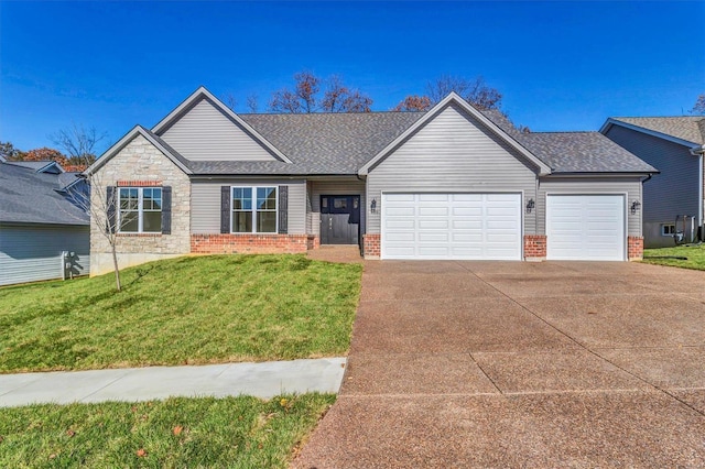 view of front of home featuring a garage and a front yard