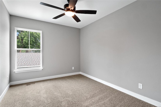 empty room with carpet floors and ceiling fan